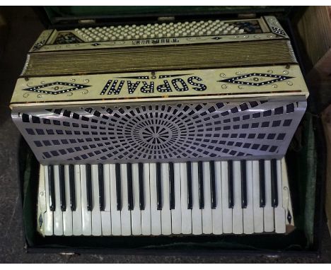 A Soprani "Three" Piano Accordion, Decorated in faux mother of pearl, with carry case