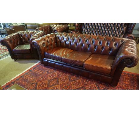 A Chesterfield Ox Blood Leather Three Piece Suite, Comprising of a club style three seater sofa, with a pair of matching armc