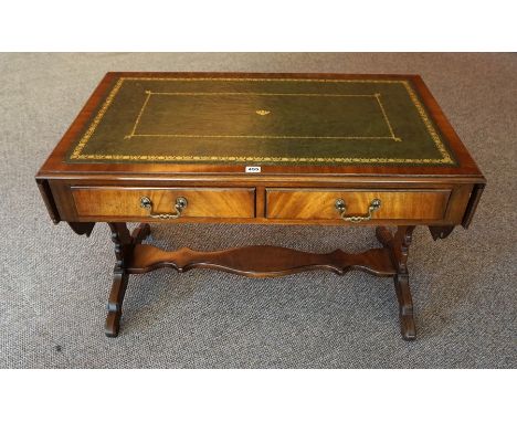 A Walnut Sofa Table, with a green and gilt tooled leather surface to the top, flanked with a drop end, above  two drawers, ra