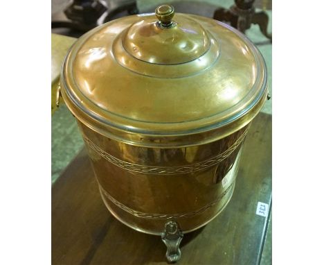 A Vintage Copper Coal Depot, Of cylindrical form, with brass handles, raised on three scroll feet, 35cm high