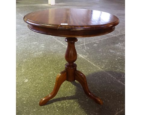 A Victorian Style Hardwood Tripod Table, with circular top raised on a turned column and tripod legs, 64cm high, 60cm wide