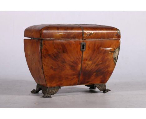 19th century tortoiseshell tea caddy of casket from having twin division interior raised on metal bracket feet, 18cm long. 