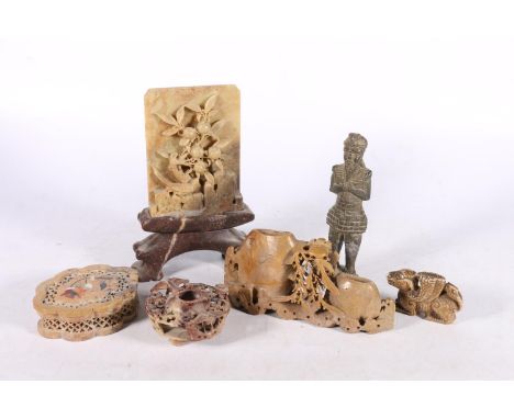 Chinese carved soapstone table panel on stand, decorated with relief fruiting tree and bird, 20cm high, a soapstone brush was