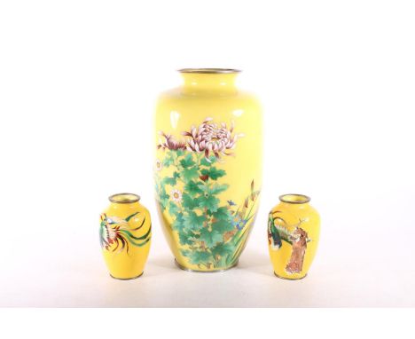 Yellow ground cloisonné enamel vase, with chrysanthemum design, 30cm high, and a pair of smaller vases.&nbsp; (3) (a/f)&nbsp;