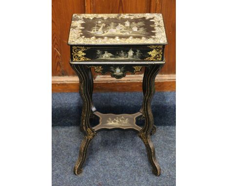 A Victorian papier mache japaned lacquer sewing  table inlaid with mother-of-pearl and abalone sheel and painted with a boat 