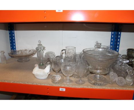 Shelf of glass to include lidded dishes, footed flower bowl, glasses, etc. 