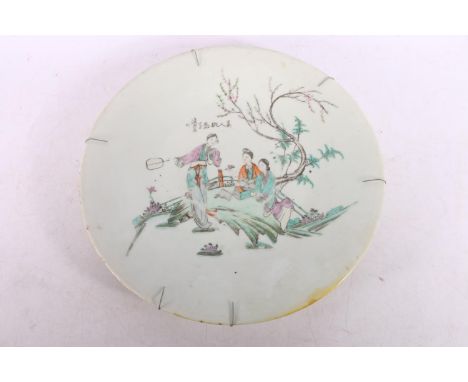 Chinese famille rose pottery plate decorated with figures in a landscape, red seal mark to reverse and black character marks 