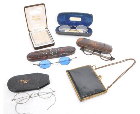 A collection of early 20th century and later vintage eyewear and accessories. To include two pairs of Vintage wire frame spec