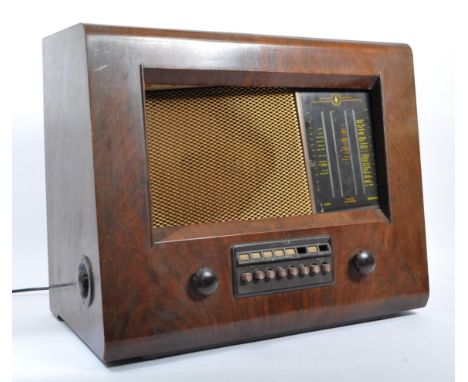 A vintage mid 20th century Bush valve A. C. receiver type PB.12 radio. Of rectangular form with makers label to top, Bakelite