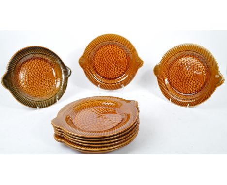 A set of nine vintage 1960s ceramic / pottery majolica fish plate set by 'Sarreguemines', France. Comprising of nine stylised