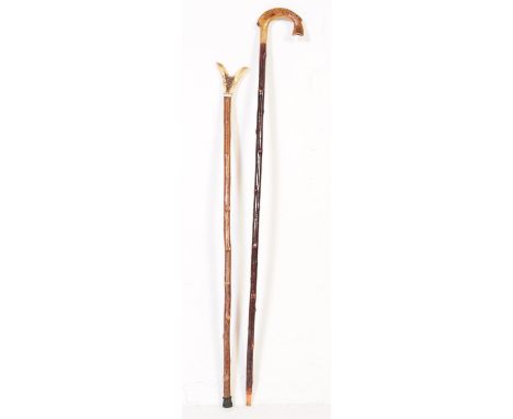 Two early 20th century walking sticks to include example with handle carved from bone in the from of a fishes tail with scale