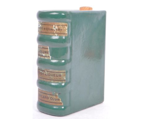 A vintage novelty ceramic book shaped flask. In a green colourway with portland Club Apricot Liqueur label to spine. Measures