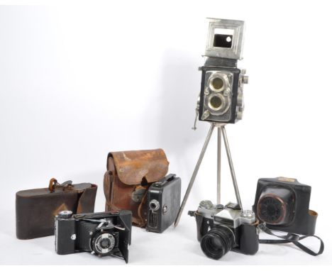 A collection of 20th century cameras. The lot to include a Zenit E 35mm SLR camera with Helios-44-2 58mm f2 lens, a Kodak Cin