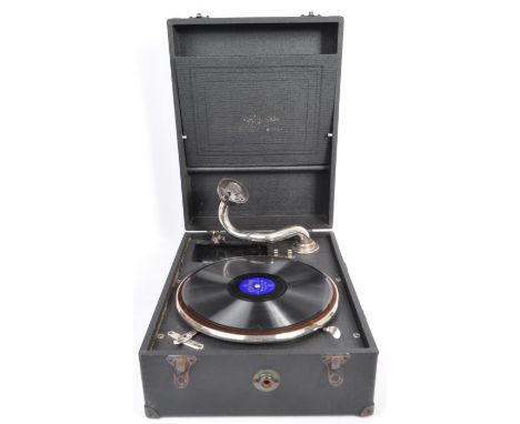 An early 20th century circa 1940s table top gramophone vinyl record player. In an ebonised case with carry handle. Measures a