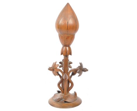 A vintage mid 20th century carved wooden adjustable table desk lamp light. Of flower form with adjustable screw to change pet