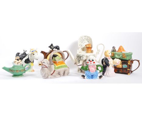 A collection of eight vintage later 20th century novelty teapots. Comprising of a various examples; Luggage/suitcase &amp; ba
