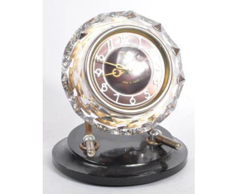 Majak, USSR - a vintage mid 20th century Russian mantle-piece / desk clock. The plastic clock of circular form with faceted e