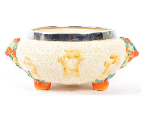 Clarice Cliff -&nbsp;An early 20th century 'Celtic Harvest' ware footed bowl by Clarice Cliff. The textured bowl with protrud