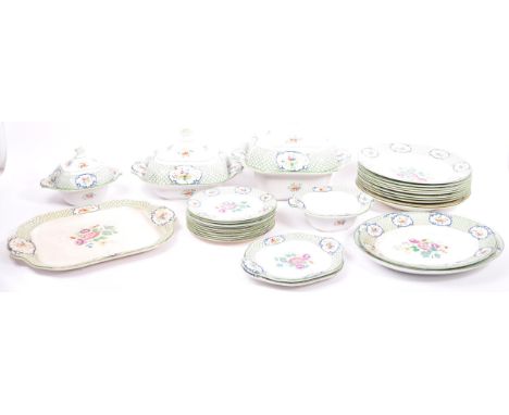 A large English Wedgwood Imperial porcelain dinner service in the rare ' Louvre ' pattern to consist of: 10 dinner plates (26