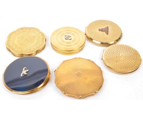 A collection of vintage 20th century vanity compacts to include a compact with blue enamel lid and embellished bow detail. Ma