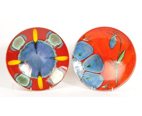 Poole Pottery - Two 20th century Poole Pottery charge plates to include an Infusion pattern plate and another in the Himalaya
