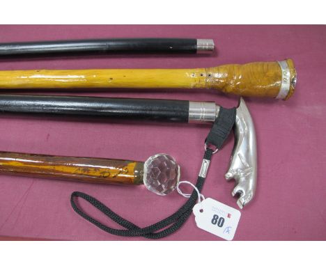 A Jaguar Handled Cane, white metal ferrule, wrist strap, 91cm long, a walking stick with glass golf ball type handle and two 