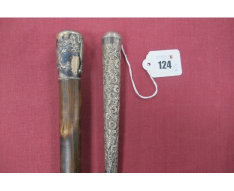 A White Metal Topped Walking Stick Marked WH90, with dragon motif, brass tip 89cm long, white metal large handled walking sti