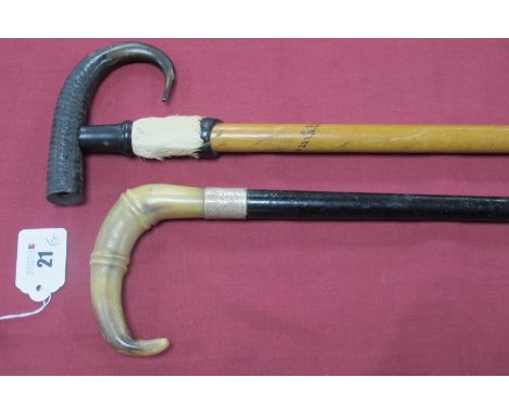 An Alpine Walking Stick with Goat and Hoof Handle, brass/steel tip, 81cm long and a horn handled cane, with silver ferrule, e