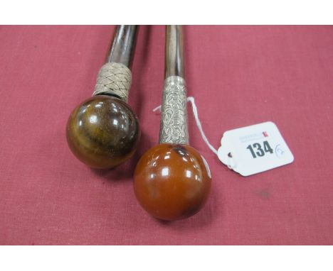 An Agate Top Stick, with white metal ferrule, hardwood cane, brass and steel tip, 92cn long, another resin topped cane, with 