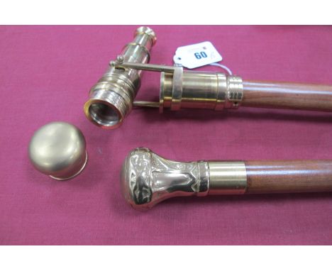 A Metamorphic Cane, with hidden telescope, break into three sections for back packing, brass tip, 96cm long, and another bras