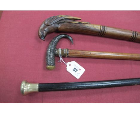 A Walking Stick, with shaped horn handle and horn ferrule terminating into a brass tip, 32.5 cm long, plus walking cane white