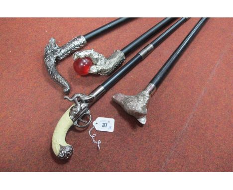 A Ball and Claw Waling Stick, wolf's head walking stick, a dragon head stick, and a percussion cap pistol as a stick, all mod