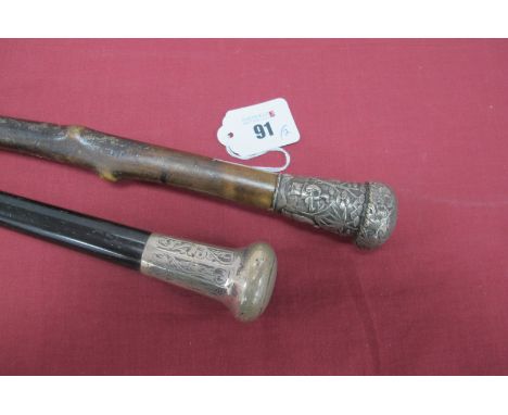 A Silver Topped Walking Cane, ebonised shaft with brass and steel tip, 91cm long and a Oriental white metal topped stick, dep