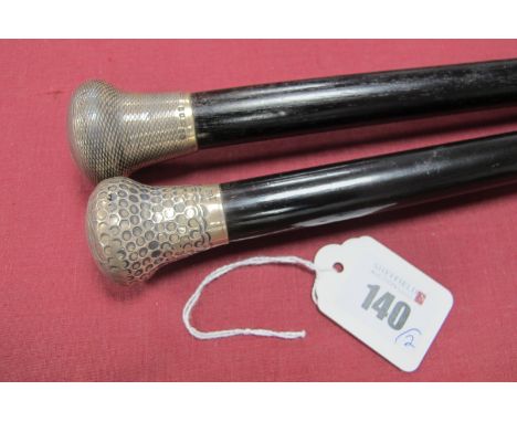 A Silver Top Walking Cane, C,E,N,R.1920 with embossed cane, brass tip 91cm long and a another with similar ebonised cane, bra