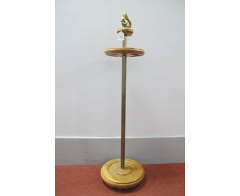 A Stick Stand in Light Oak, takes eight shafts, heavy brass hexagonal column, four brass feet, brass squirrel sat on top, 103