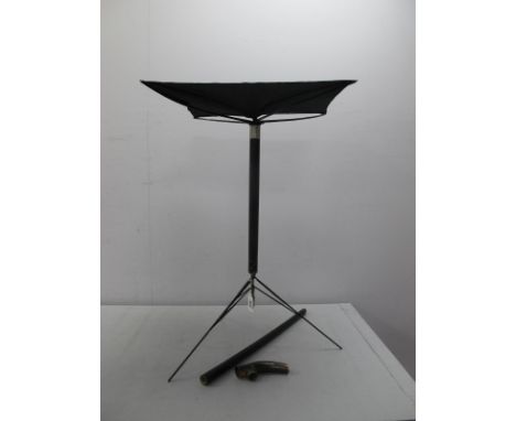 A Metamorphic Card Table Walking Cane, the cane unscrews in two, polished horn handle, white metal ferrule and brass tip, 88c