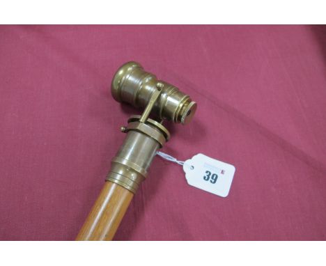 A Walking Stick, in three sections with metamorphic handle which changes into a telescope, brass and rubber tip. 96cm long.