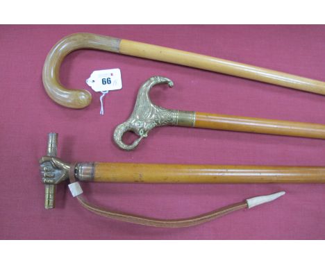 A Malaca Stick, with brass fist handle holding a baton, wrist hoop, copper ferrule, very long brass tip, 106cm long, a Malaca