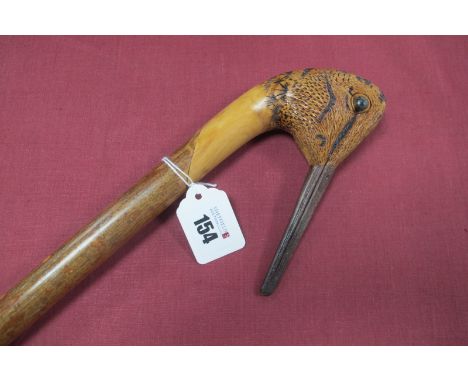 An Ian Taylor Woodcock Topped Wading Cane, with ash shaft, (monogrammed under neck), 134cm long. *Ian Taylor is one of the mo