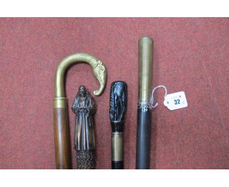 A Metal Top Cane in The Shape of a Monk Holding a Cross, a bent brass horse handle cane, and a heavy brass handled stick, ben