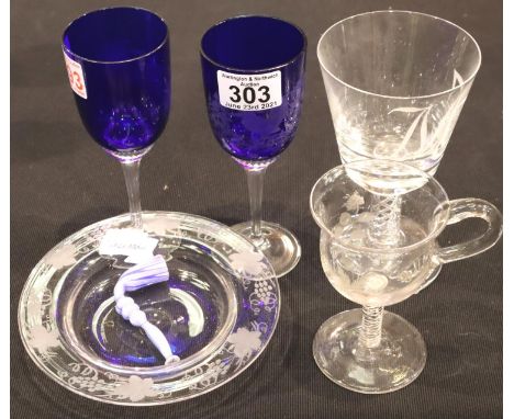 19th and 20th century glass, including an etched bottle coaster, pair of etched blue wine glasses, two air-twist stem example