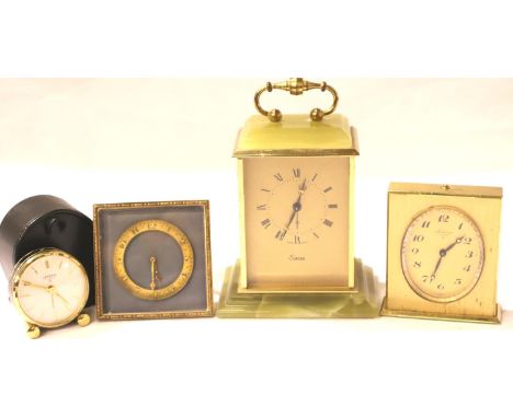 Looping, an eight day eighteen jewel brass cased alarm clock, a further Looping travel clock, a Swiza onyx and brass cased me