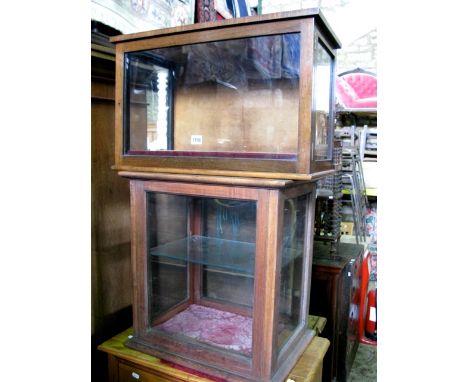 A small vintage, probably 19th century, mahogany wall mounted display cabinet of rectangular form enclosed by a single glazed