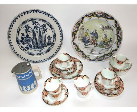 A 19th century tin glazed earthenware charger with painted blue floral and foliate decoration, 34cm a further continental cha