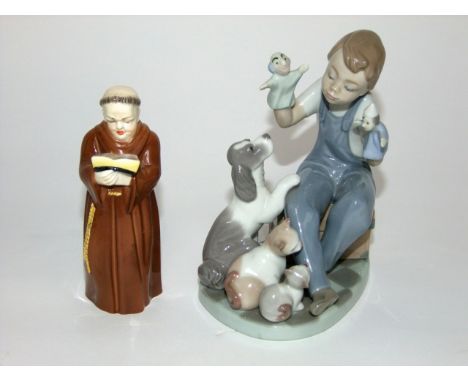 A Lladro Daisa figure group of a child giving a puppet show to a dog, a cat and a kitten with printed marks to base and impre