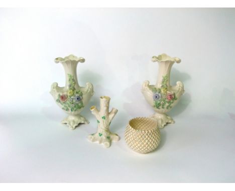 A collection of Belleek wares comprising a pair of vases with encrusted floral decoration height 23cm, a bowl with moulded lo