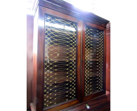 A Georgian mahogany bureau bookcase, the bureau of four long graduated drawers, the fall flap with fitted interior, the bookc