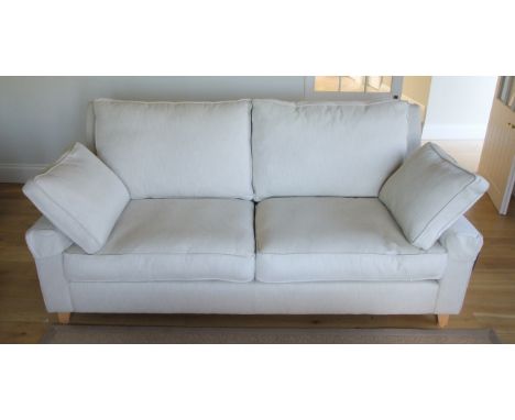 A Wesley Barrell Burleigh high back three and a half seater sofa in a Ian Sanderson Phoenix oatmeal coloured fabric on a natu