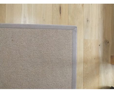 A good quality carpet square in pale oatmeal with over sewn borders, 132cm x 220cm 