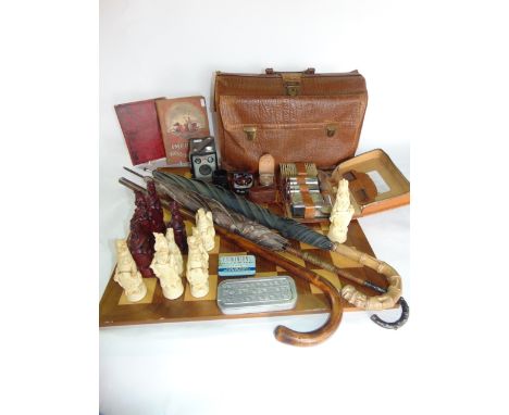 A Royal Beasts chest set complete with board, a vintage leather brief case, a number of umbrellas, photographic equipment, et